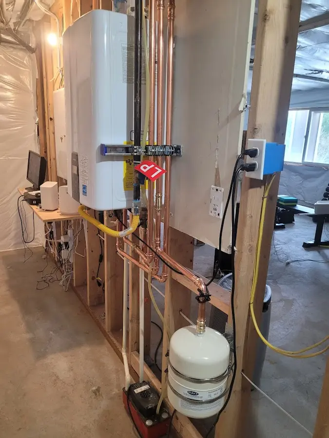 Licensed plumber repairing a kitchen sink in Willis